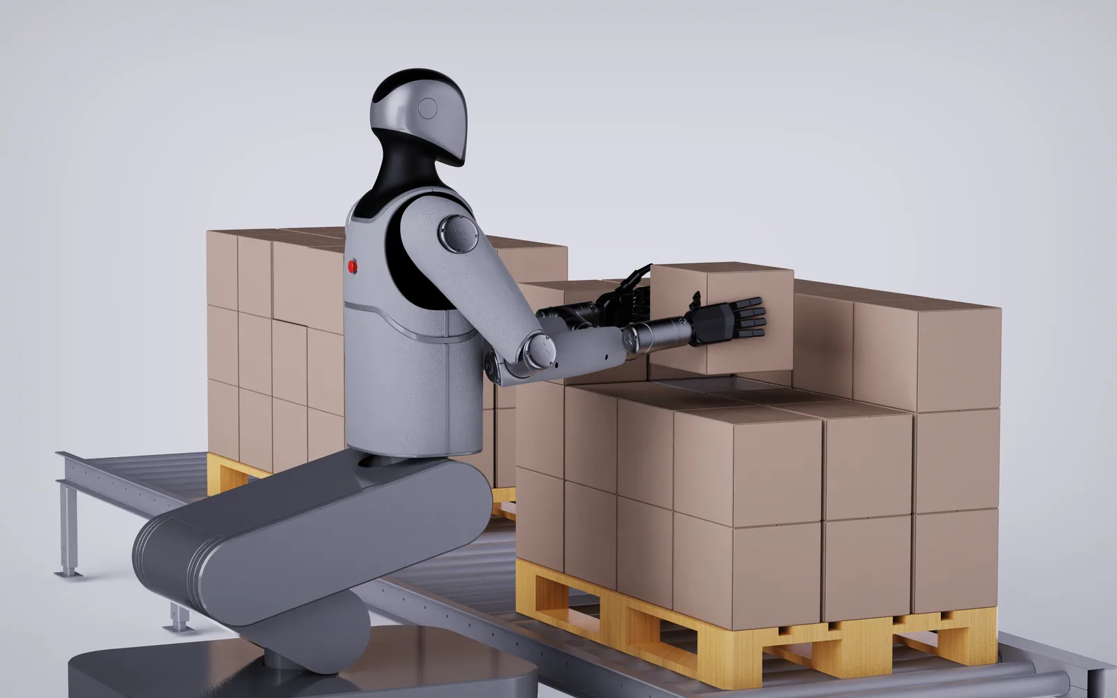 MARK One stacking cartons on a pallet next to a roller conveyor
