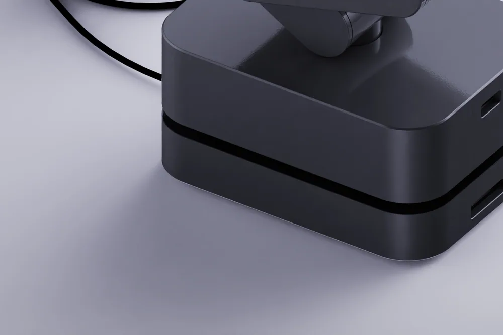 The dark base of MARK One on its charging dock